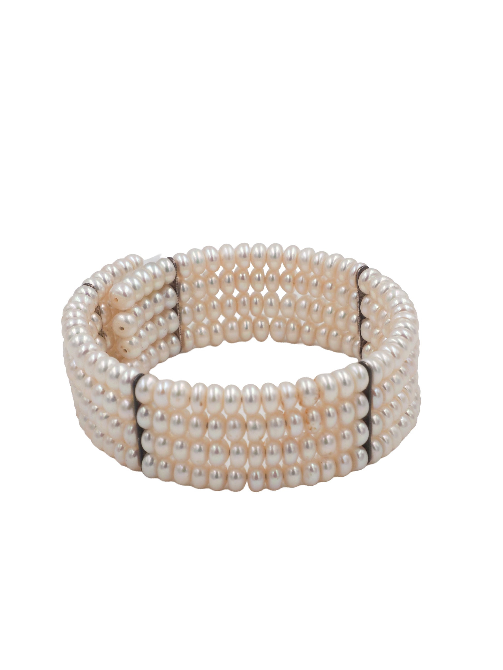 A vintage beaded wrap bracelet featuring rows of small, lustrous cream-colored pearls separated by thin black spacer beads