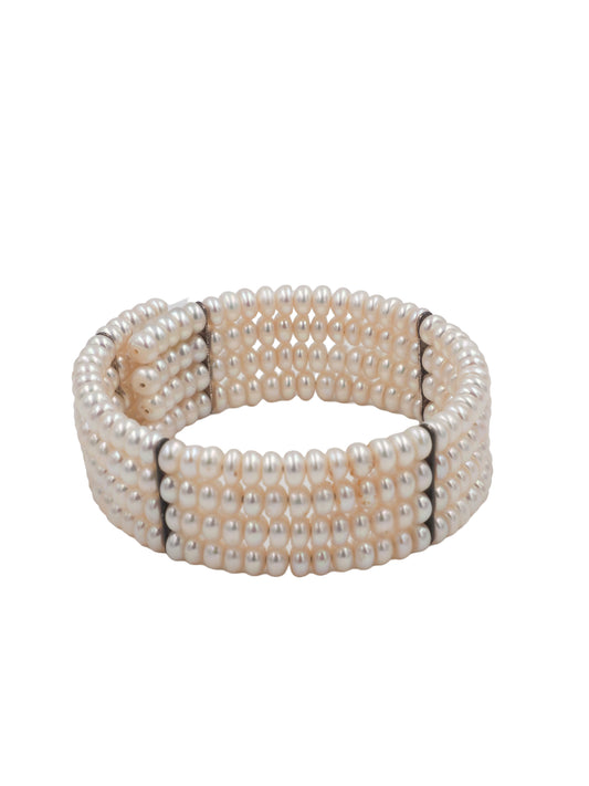 A vintage beaded wrap bracelet featuring rows of small, lustrous cream-colored pearls separated by thin black spacer beads
