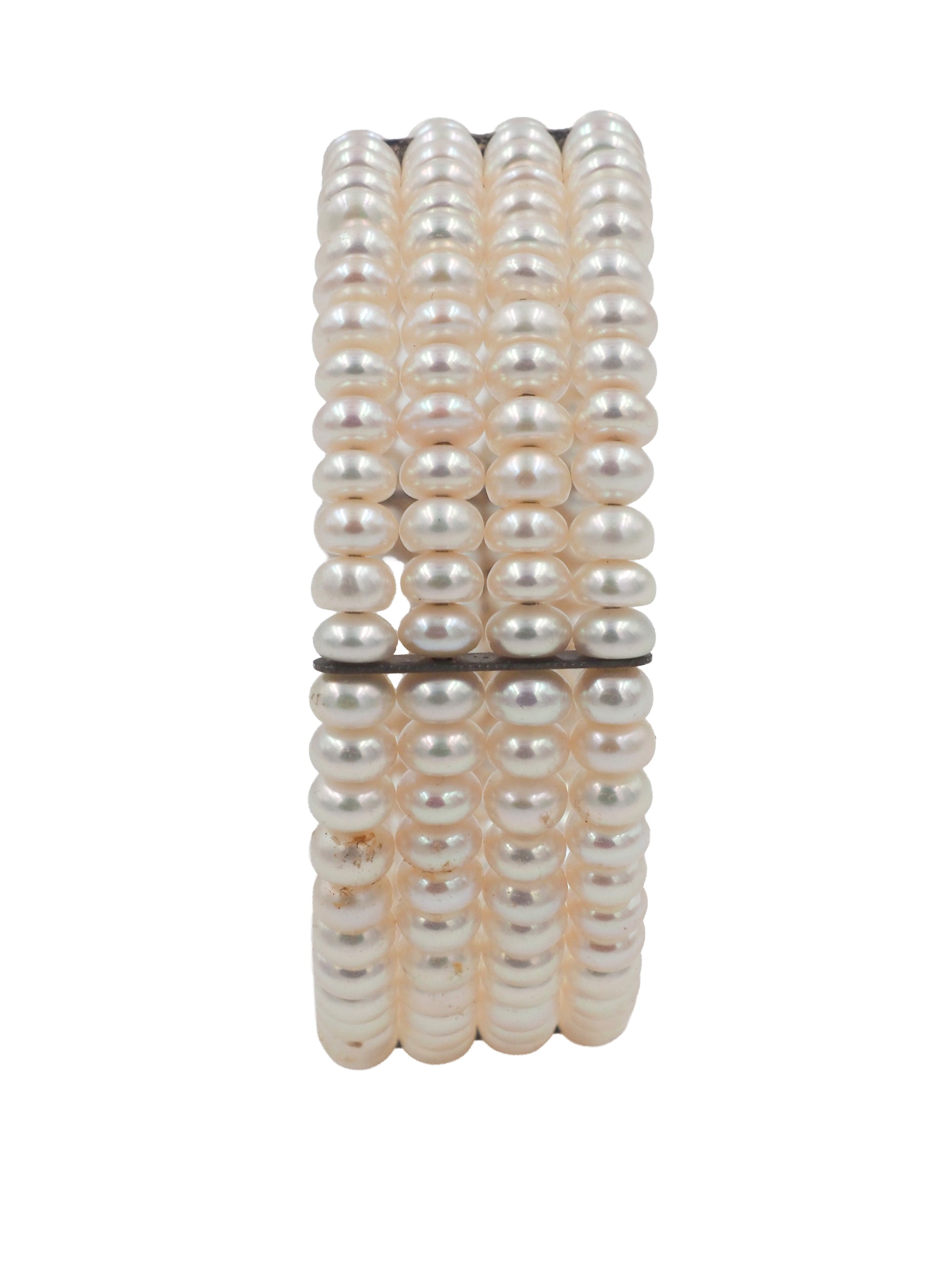 A vintage beaded wrap bracelet featuring rows of small, lustrous cream-colored pearls separated by thin black spacer beads