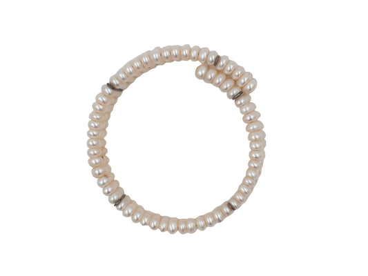 A vintage beaded wrap bracelet featuring rows of small, lustrous cream-colored pearls separated by thin black spacer beads