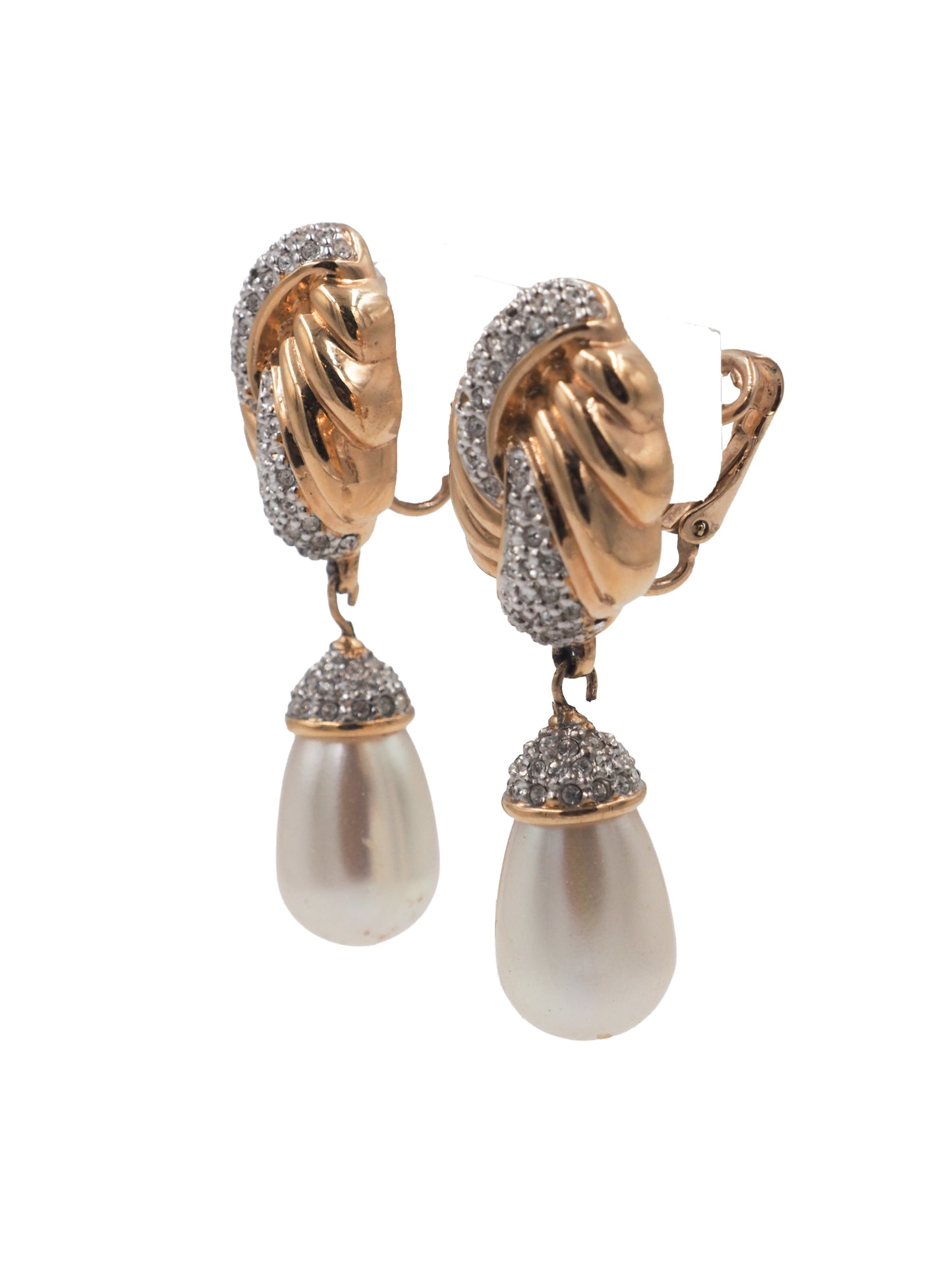 A pair of vintage gold and silver drop earrings featuring a twisted knot design paved with clear stones, with a teardrop-shaped white pearl hanging below each earring