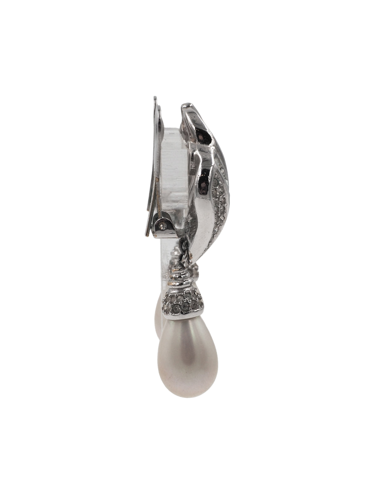 A pair of silver-toned drop earrings featuring a curved, pavé-set crystal design above a teardrop-shaped white pearl