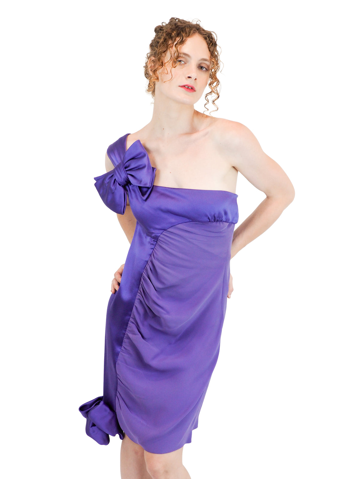 A vintage 2008 Valentino one-shoulder purple dress with a large bow detail on the shoulder and a gathered ruched skirt