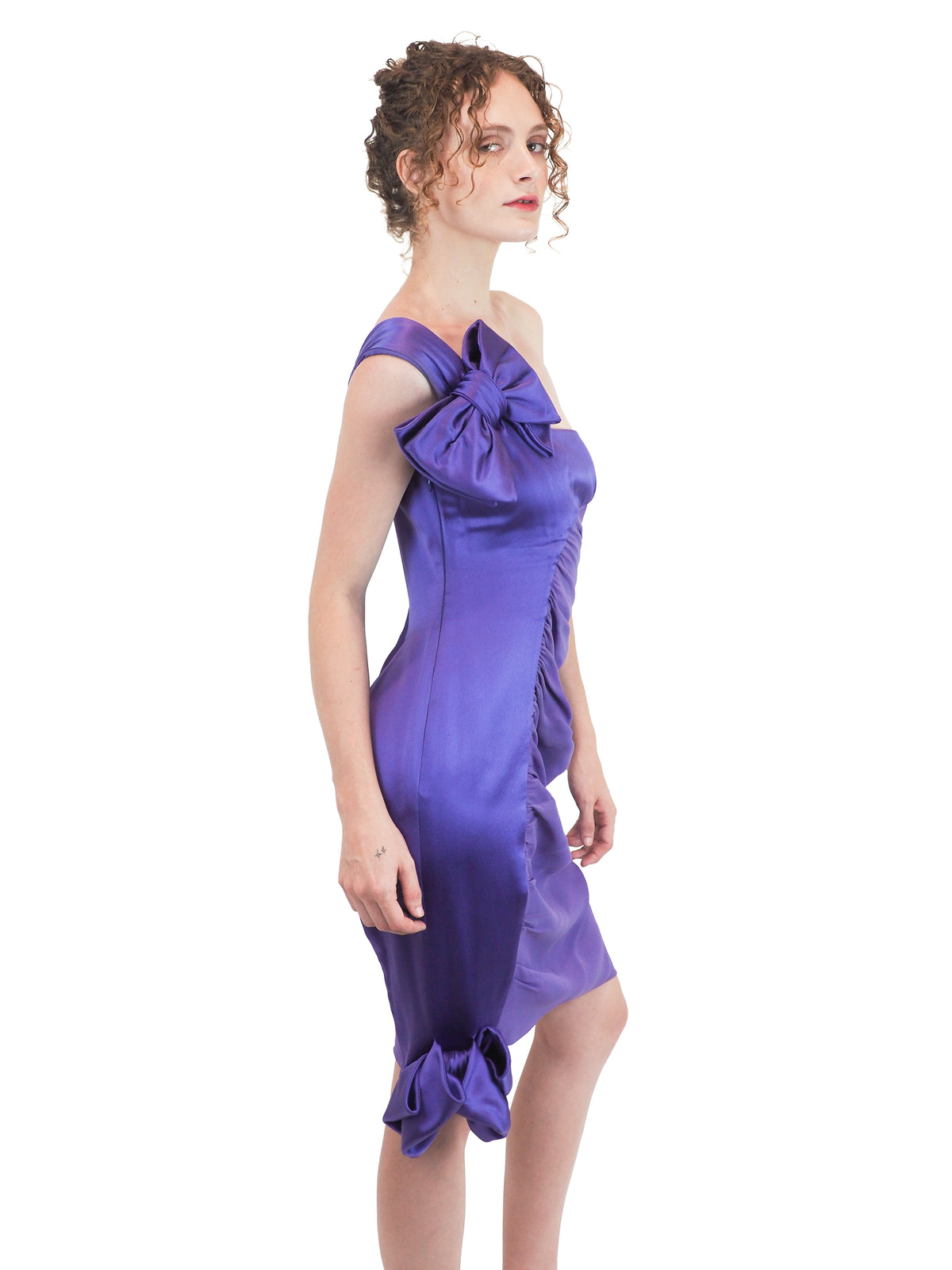 A vintage 2008 Valentino one-shoulder purple dress with a large bow detail on the shoulder and a gathered ruched skirt