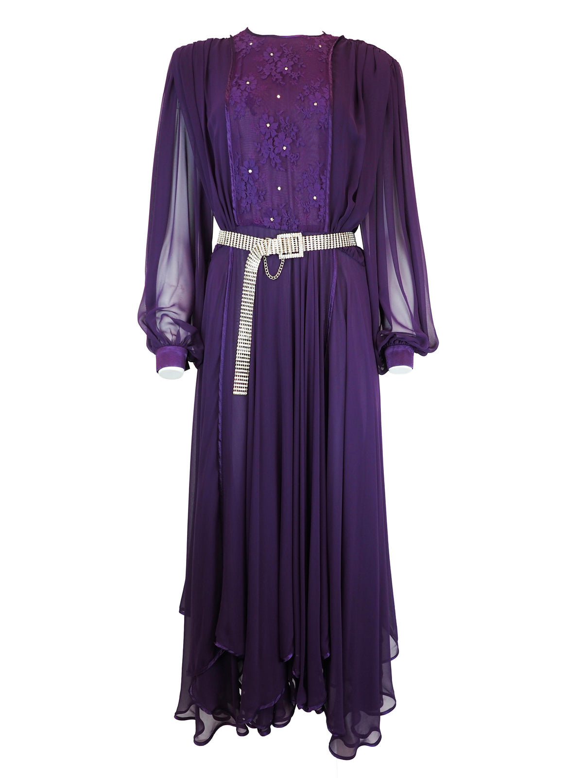 A vintage long-sleeved purple maxi dress with a sheer mesh overlay, a sequined embroidered bodice, and a silver rhinestone-embellished belt