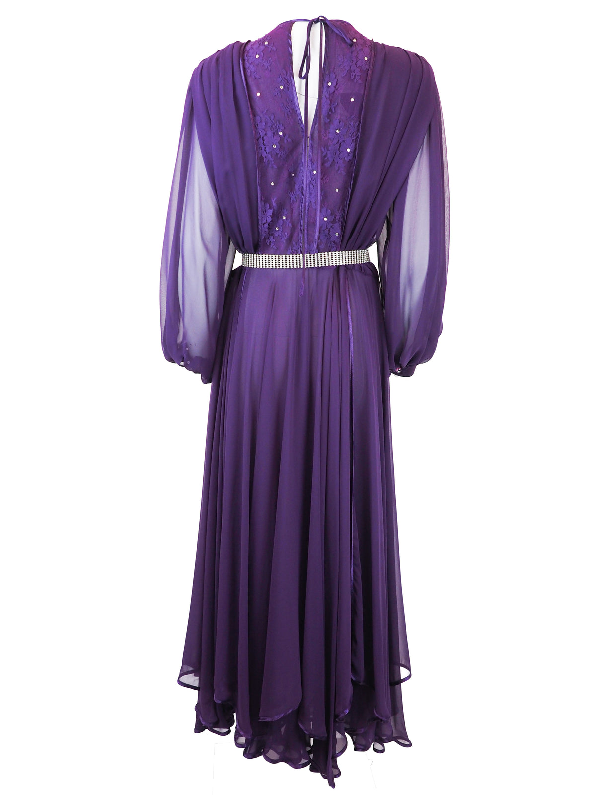 A vintage long-sleeved purple maxi dress with a sheer mesh overlay, a sequined embroidered bodice, and a silver rhinestone-embellished belt