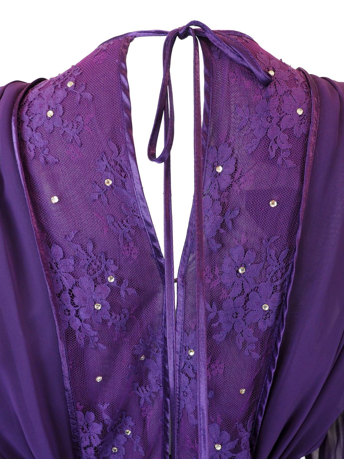 A vintage long-sleeved purple maxi dress with a sheer mesh overlay, a sequined embroidered bodice, and a silver rhinestone-embellished belt
