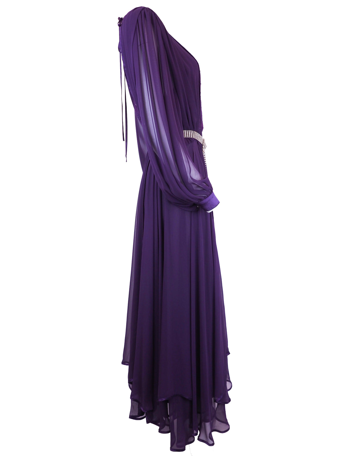 A vintage long-sleeved purple maxi dress with a sheer mesh overlay, a sequined embroidered bodice, and a silver rhinestone-embellished belt
