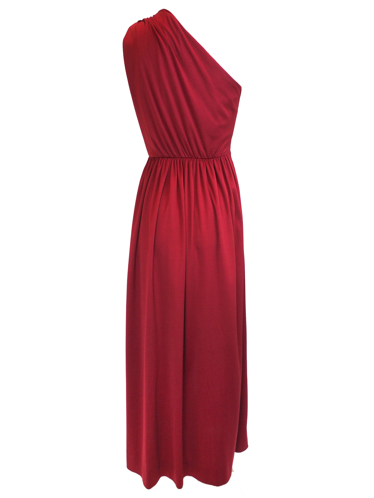 A vintage 1970s red one-shoulder maxi dress with a draped, wrap-style bodice and a matching waist tie
