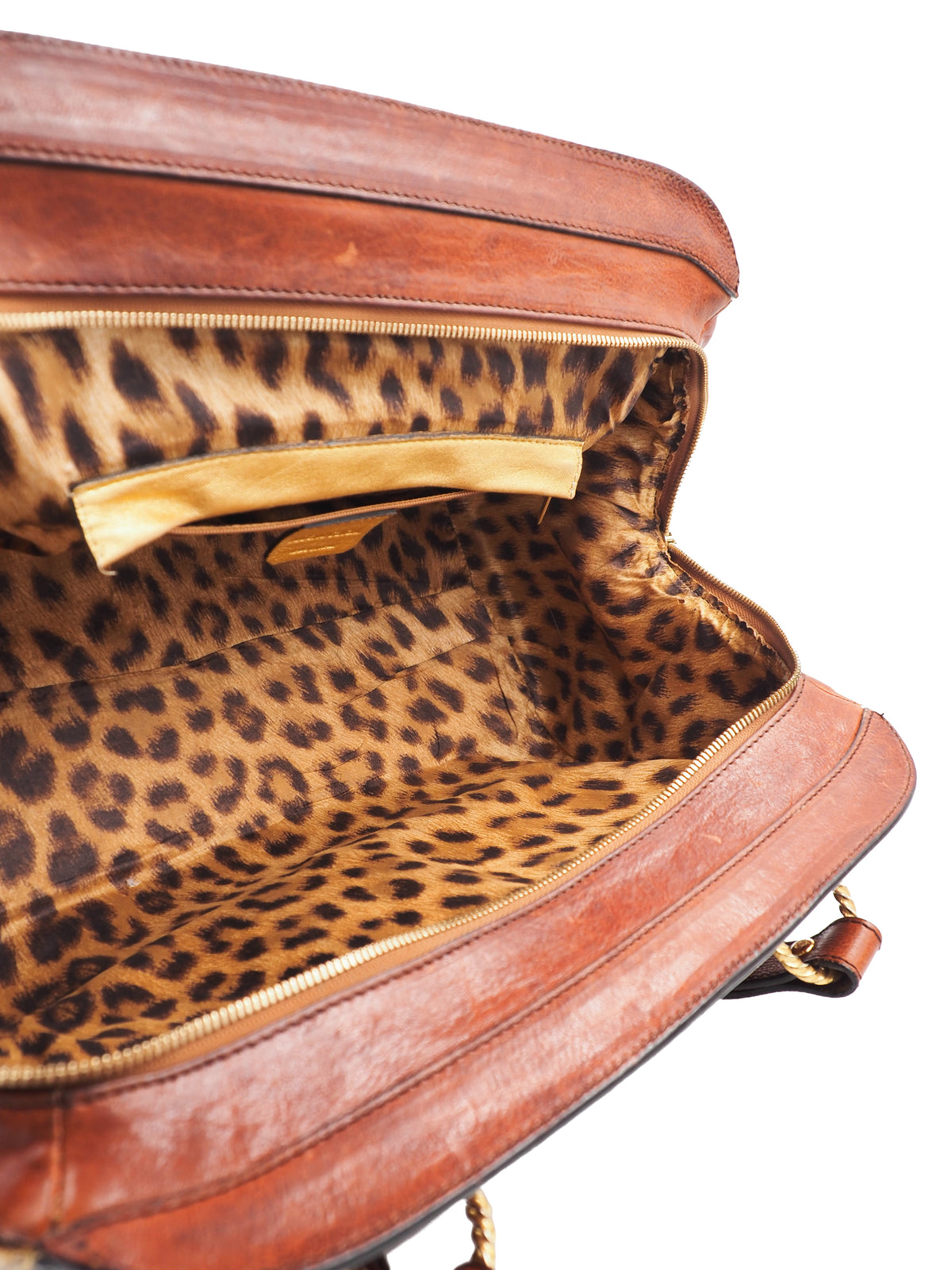 A vintage Roberto cavalli brown leather duffel-style handbag with rope handles and gold-tone hardware