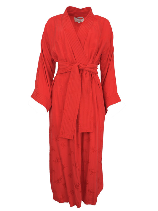 A vibrant red wrap robe with a matching waist tie belt, featuring a subtle tonal floral jacquard pattern near the lower hem