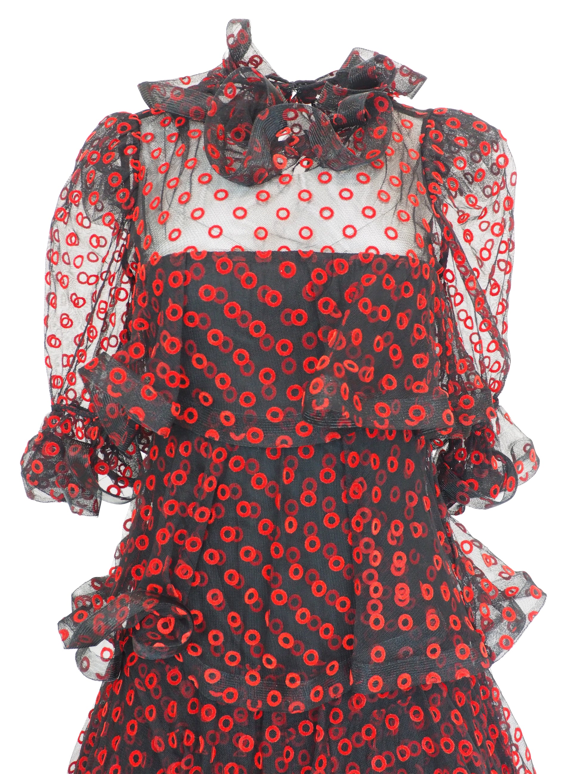 A vintage Arnold Scaasi designer black sheer mesh dress with a red and black poppy print, featuring a ruffled high neck, long puff sleeves, and a tiered ruffled skirt
