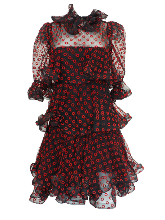 A vintage Arnold Scaasi designer black sheer mesh dress with a red and black poppy print, featuring a ruffled high neck, long puff sleeves, and a tiered ruffled skirt