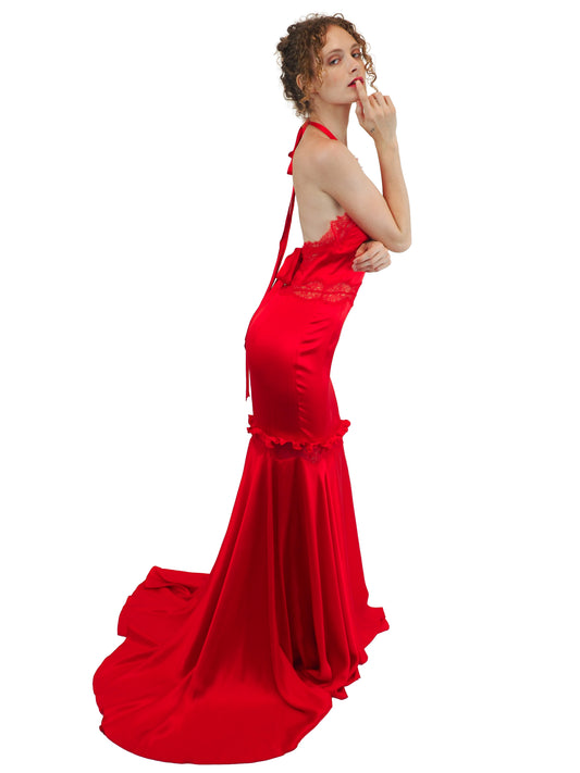 A vintage Valentino Y2K vibrant red silk halter-neck gown with lace detailing on the bodice and waist