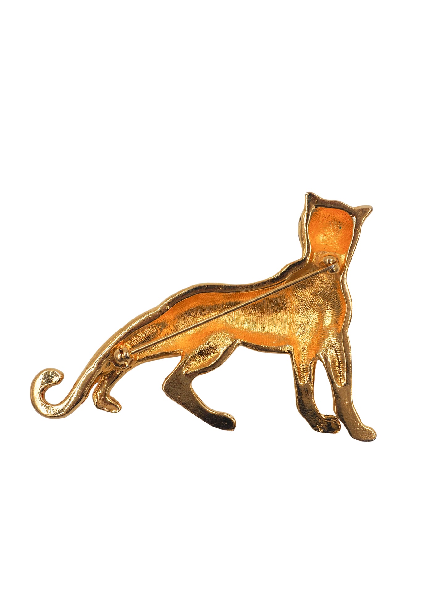 A vintage gold leopard-shaped brooch with black enamel spots and green gemstone eyes