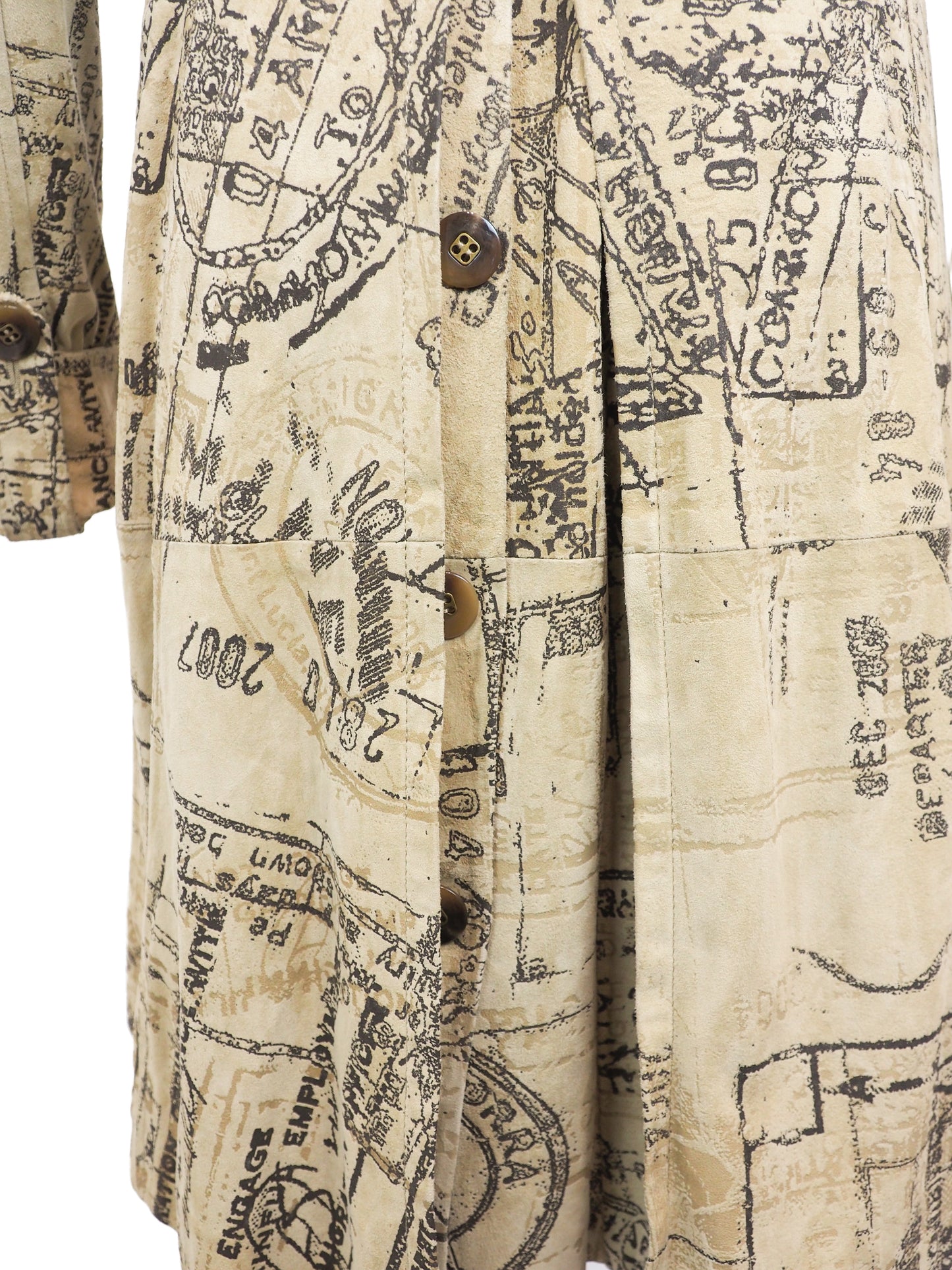 A Diane Von Furstenberg beige trench coat with an all-over black vintage map and script print, featuring a double-breasted design with brown buttons and a matching waist tie, shown against a plain white background.