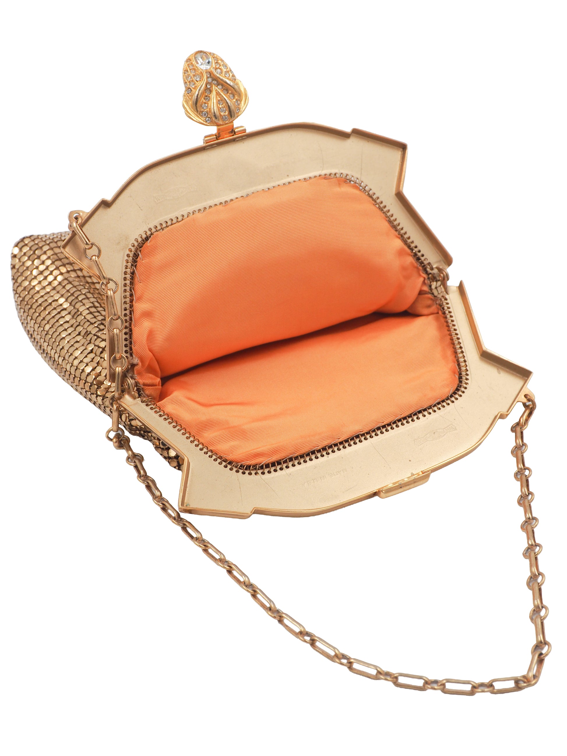 whiting & Davis Gold-tone metal kiss-lock clutch handbag with a gold chain strap, featuring a textured gold mesh body, a decorative top clasp, and a bright orange satin interior lining.