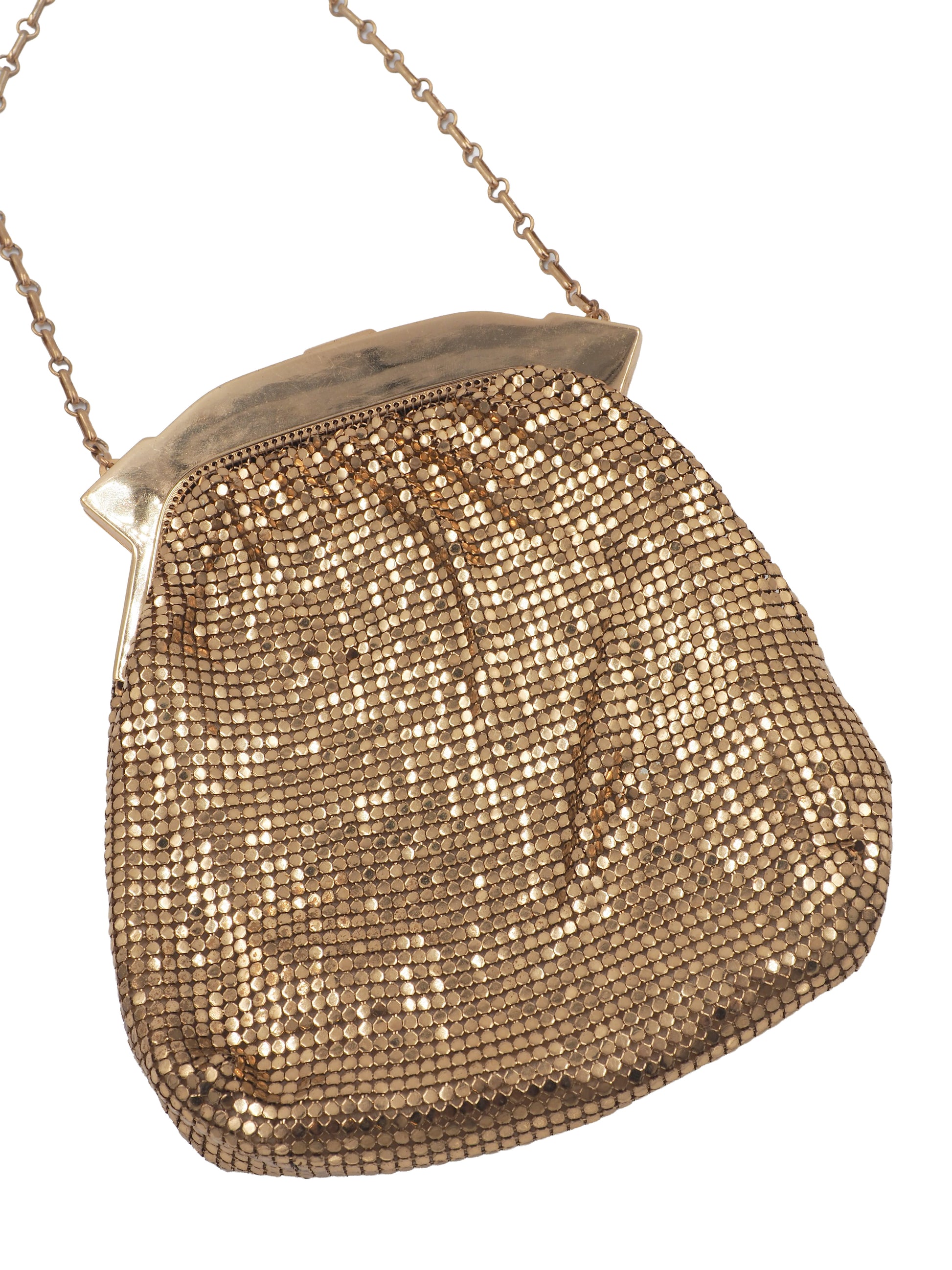 A vintage whiting and Davis gold-tone mesh clutch purse with a chain strap and a silver-tone metal frame